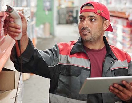 This person is scanning and logging inventory as part of his job as a Warehouse Associate.